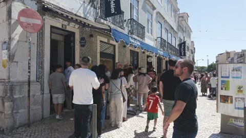 Crowds lining outside Pastéis de Belém Lisbon Portugal Stock Footage 315219732