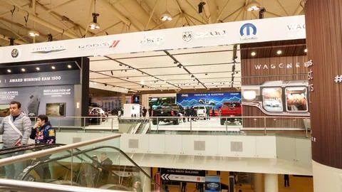 Crowds looking at new car models at Auto show. National Canadian Auto Show wi Stock Photos