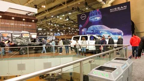 Crowds looking at new car models at Auto show. National Canadian Auto Show .. Stock Photos
