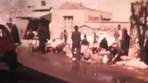 Crowds marching during Iranian Revolution in Tehran, 1979 Stock Footage 325854923