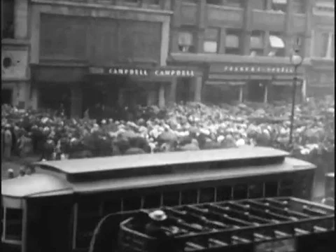 Crowds of mourners gather on the streets of New York City for Rudolph Stock Footage