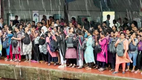 Crowds move to board train. 4K (Busy train station). Stock Footage 249250779