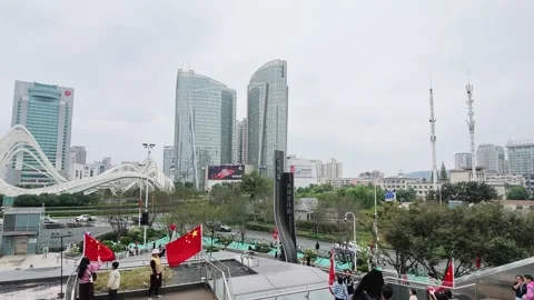 Crowds moving through Optics Valley Square in Wuhan Stock Footage 347179048