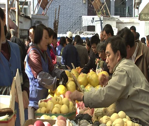 Crowds at outdoor fruit and vegetable market Stock Footage 86745250