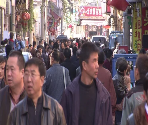 Crowds of pedestrians walking through retail area in Beijing Stock Footage 86745232