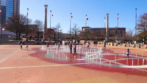 Crowds of people at Centennial Olympic Park gather close together during the  Stock Footage 147613969