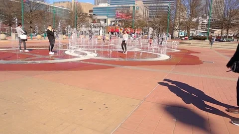 Crowds of people at Centennial Olympic Park gather during the covid-19 outbre Stock Footage 147614342