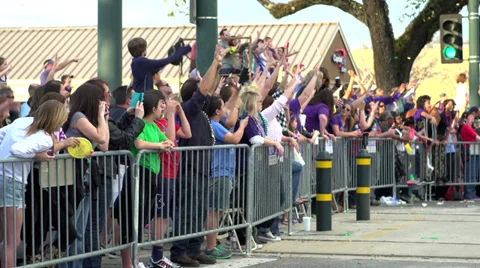 Crowds of people cheering on fence of Endymion 2014 Stock Footage