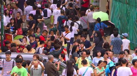 CROWDS OF PEOPLE ON COBBLED R DE SAO PAULO MACAU Stock Footage 67032115
