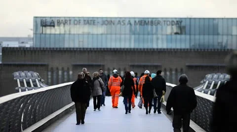 Crowds of people crossing a bridge Stock Footage 10712948