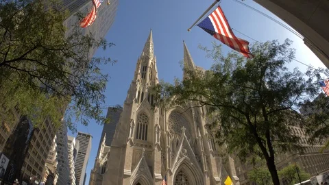 Crowds of people gather in front of St. Patrick's Cathedral to take pictures of Stock Footage 86323588
