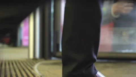 Crowds of people go in and out through revolving doors in mall. Timelapse looped Stock Footage 73561953