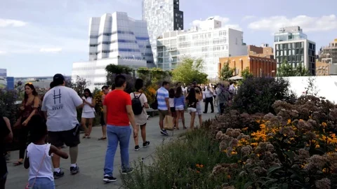 Crowds of people on the High Line, an elevated park in New York City Stock Footage 93445576