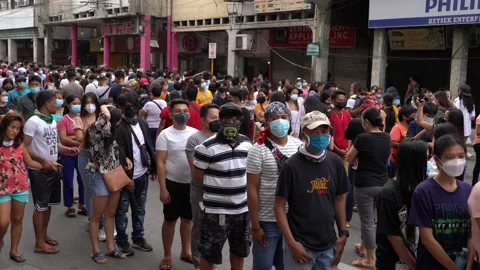 Crowds of people queue to enter the Basilica del Santo Nino church in Cebu City Video stock 168578640