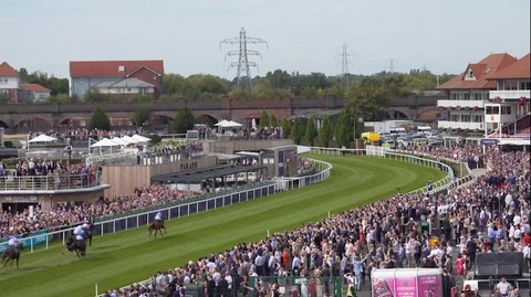 Crowds of people in the stands at Chester Horse Races, England Stock Footage