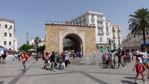 Crowds of people visit Bab el Bhar monument, tourism history Tunis Tunisia Stock Footage 334380504
