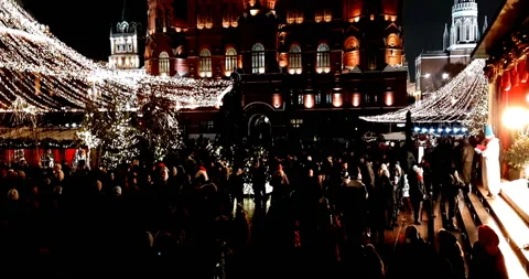 Crowds of people walk in the evening Stock Footage 123136173