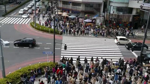 Crowds of people walking through Harajuku, Tokyo in Japan Stock Footage
