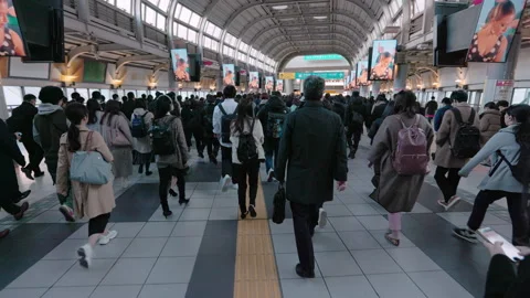 Crowds of rush hour commuters in Tokyo from behind. Stock Footage 295222990
