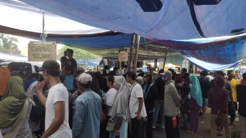 Crowds of Secondhand Clothing Shoppers in The Secondhand Market in Indonesia Stock Footage 307455038