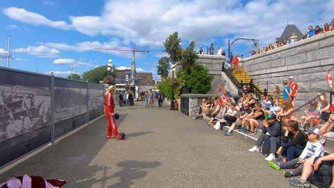 Crowds Sitting On Steps Watching Street Performer At Victoria Harbour, Stock Footage 122231699