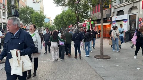 Crowds strolling along busy pedestrian street in Madrid Stock-Footage 334331519