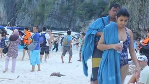 Crowds of tourists enjoy a trip at Maya Bay Stock Footage 73787776