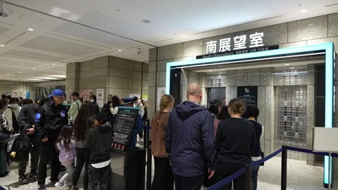 Crowds of tourists wait in line for the South Observatory elevator. Stock Footage 346011396