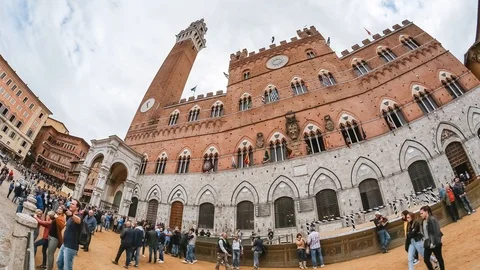 Crowds of tourists walking at the Campo Square in Siena city Stock Footage 103608732