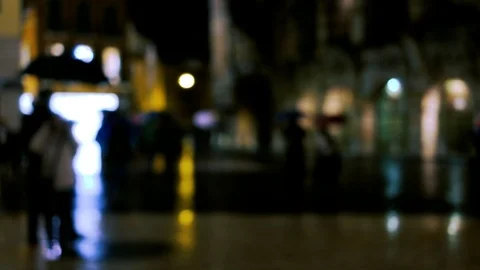 Crowds of unrecognizable people at the rainy night city street Video stock 90486853