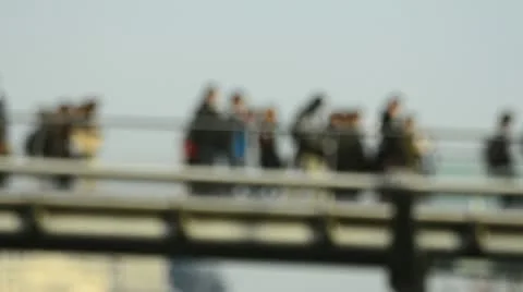 Crowds walking across Milenium bridge, London (defocused) Stock Footage 10888968