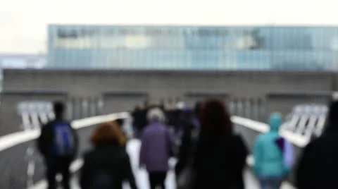 Crowds walking across a narrow bridge Stock Footage 10712912