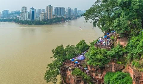 Crowds walking down the plank walk around Giant Buddha Stock Photos