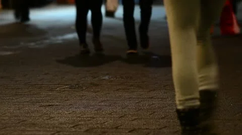 Crowds walking in London street at night Stock Footage