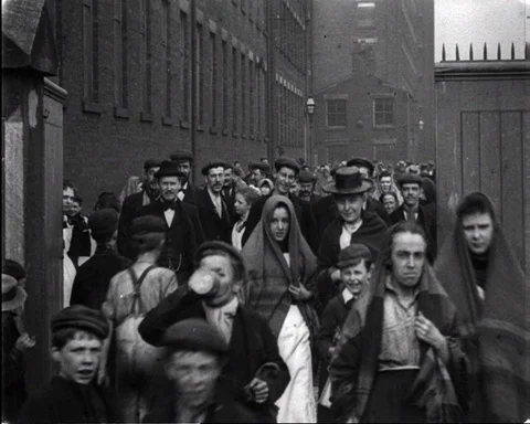 Crowds of workers leaving work at North-Street Mills, Chorley 1900 Video stock 133372459