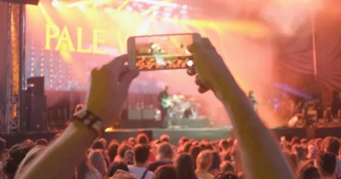 Crowdshot Live-Music-Show-guy-with-phone-filming 422 25FPS Stock Footage 128442444