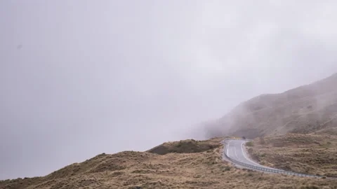 Crown Range, New Zealand Timelapse of cars emerging from clouds 8K Stock Footage 237485341