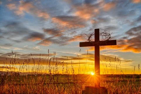Crown of Thorns On Cross Sunset Grasslands Right Side Stock Photos