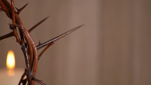 Crown of Thorns with Lit Candle in the Background. Communion Video stock 128710194