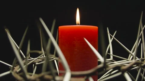 The crown of thorns with a red burning candle inside in rotation. Easter. Stock Footage 303955277