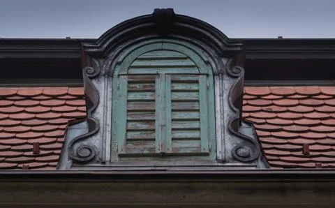A crown window, old surrounded by tile Stock Photos