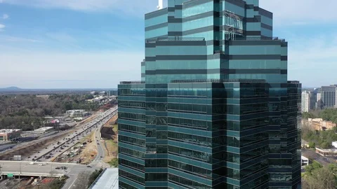Crowned Glass Office Tower over Sandy Springs, Georgia Stock Footage 104262674