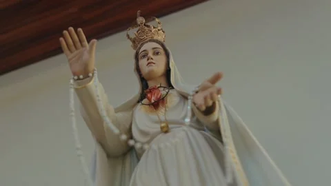 Crowned Our Lady of Fatima statue with Immaculate Heart and open arms Stock Footage 337913855