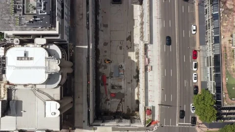 Crows Nest Metro station construction cranes in pit over tunnels – aerial 4k. Stock Footage 148980489