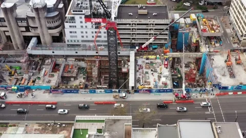 Crows Nest Metro station construction cranes in pit over tunnels – aerial 4k. Stock Footage 229929852