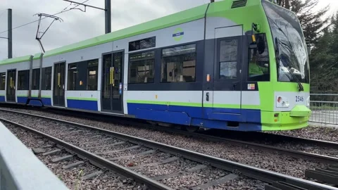 Croydon Tram slowing down towards tramstop 4K Stock Footage 148033146
