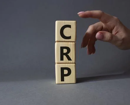CRP - C-Reactive Protein Test symbol. Wooden cubes with word CRP. Doctor ha.. 写真素材