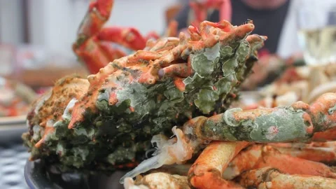 Crubs on the table to enjoy them Stock Footage 239108670