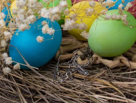 Crucifix and Easter eggs Stock Photos