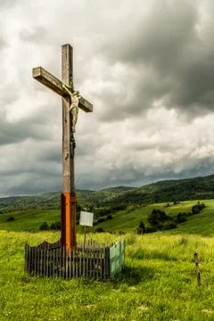 Crucifix. On the background of the cloudy sky. Stock Photos